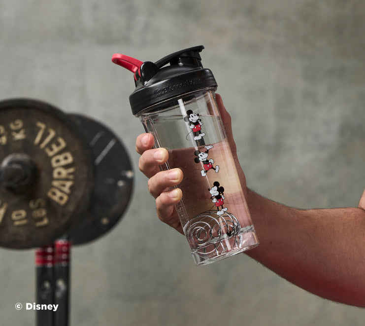 pro-series-u4 Mickey_Mouse_Protein_Shaker_Bottle_Being_Held_In_the_Gym.jpg